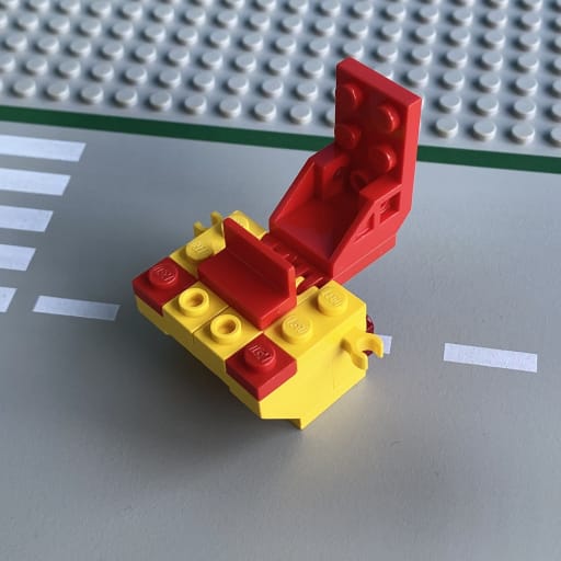 The rear loader mechanism for the hopper