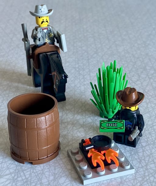 The sheriff riding up behind the bandit sitting at the campfire