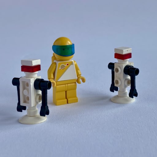 The minifigure and the two small droids
