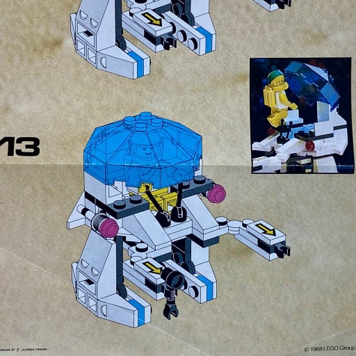 Instruction booklet, step 13, adding the transparent canopy and the minifigure
