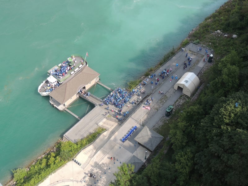 Maid of the Mist boat sailing toward the falls from the American shore