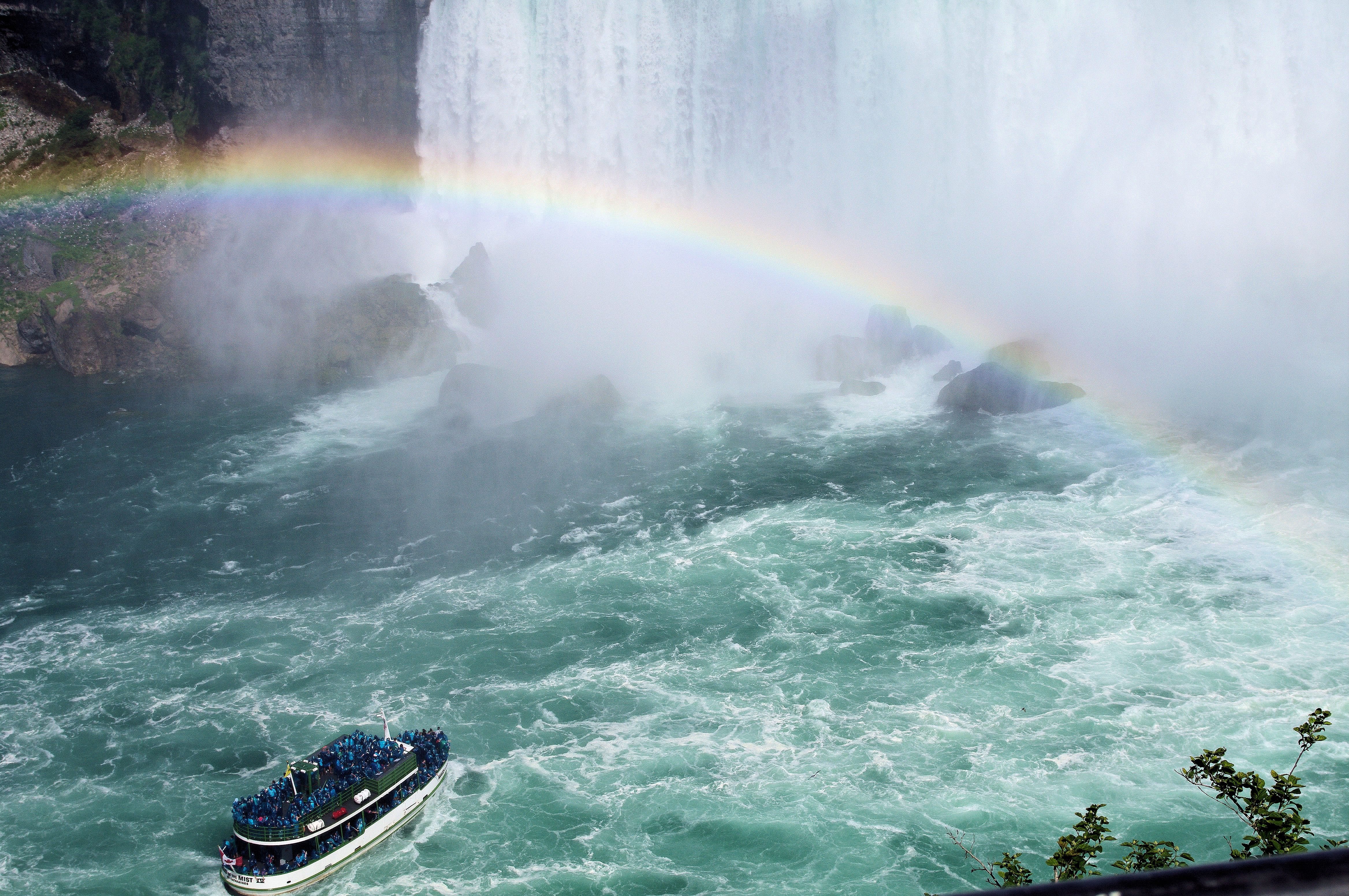Passengers in ponchos on the Maid of the Mist in the spray