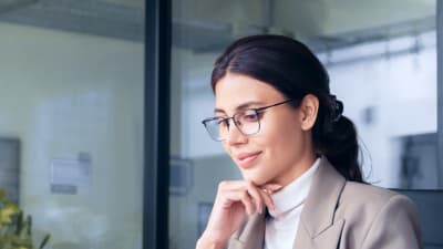 Businesswoman working on a laptop in an office setting