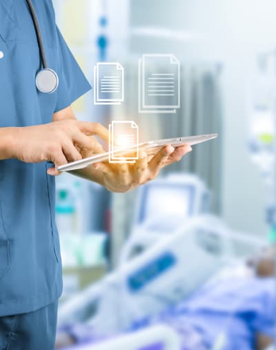 Doctor using cloud-based imaging program on tablet in a hospital 