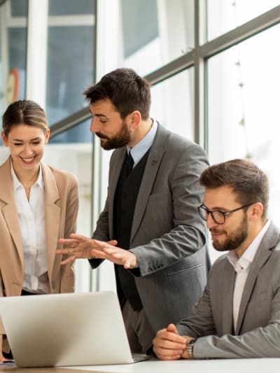 Three business people discussing