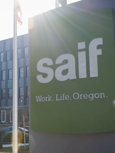 Green SAIF business sign with the company’s tagline, “Work. Life. Oregon.