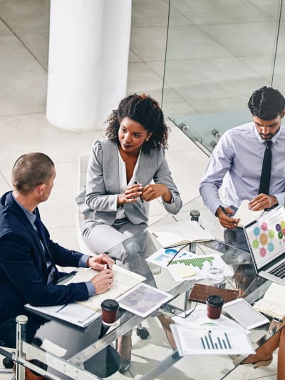 Business people and manager with laptop on desk for financial meeting, pitch or presentation.