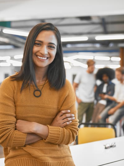 Women smiling while looking at the camera