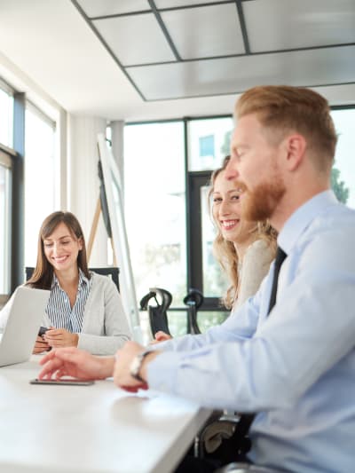 A group of professionals discussing on a table.