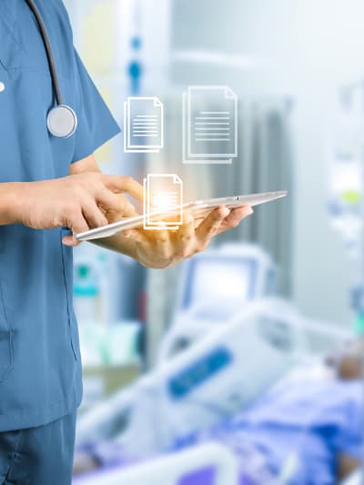 Doctor using cloud-based imaging program on tablet in a hospital 