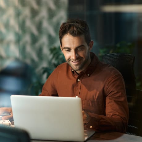 A person takes a virtual meeting with a co-worker in another country.