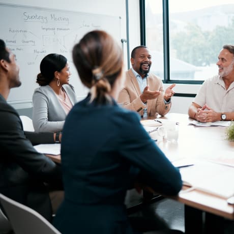 Teammates at table in meeting