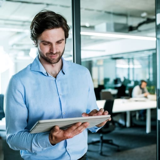 A man looking at a tablet