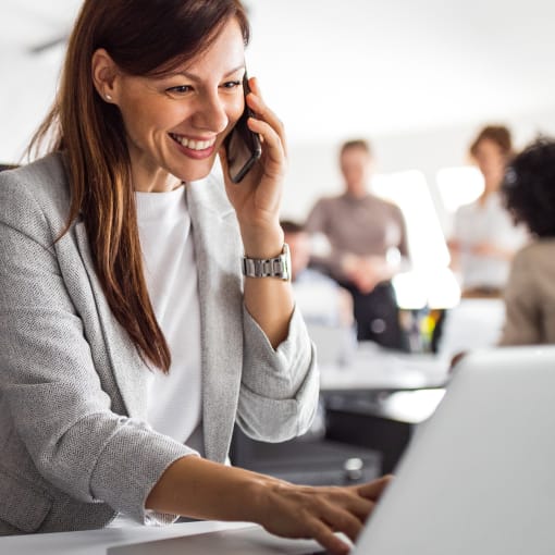 Person in office discovers digital government insights on their laptop computer.