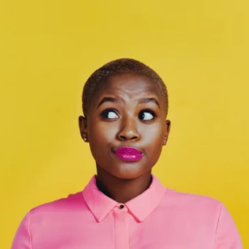 Person in pink button-down shirt shrugs, with bright yellow background.