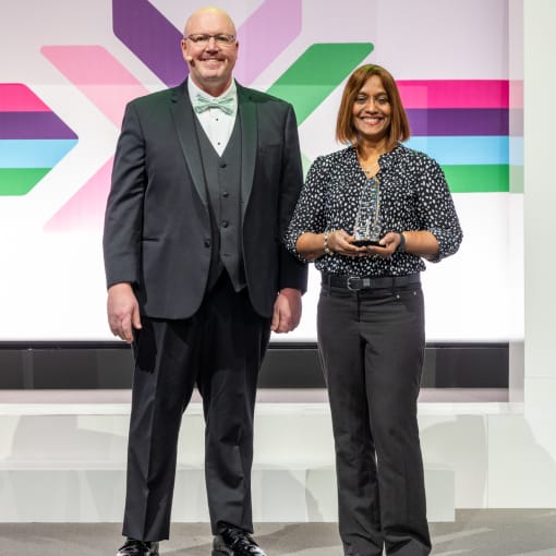 Photo of Ed McQuiston, chief customer officer at Hyland, and award recepient