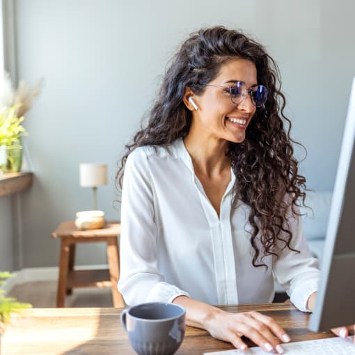 Smiling woman working at a computer