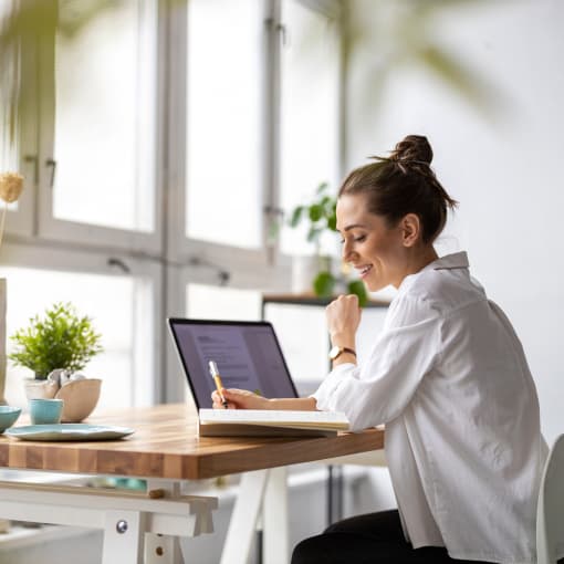 girl sitting and writing notes