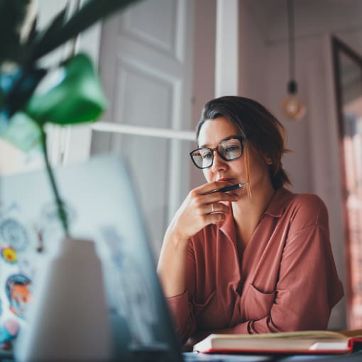 Woman sitting at a desk in a home office.