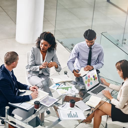 Business people and manager with laptop on desk for financial meeting, pitch or presentation.