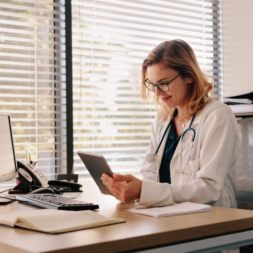 Doctor looking at tablet