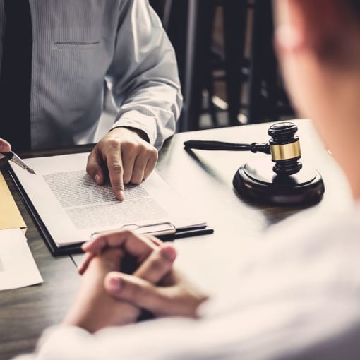 Two people discussing legal documents