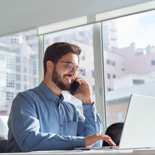 Man in glasses taking a call