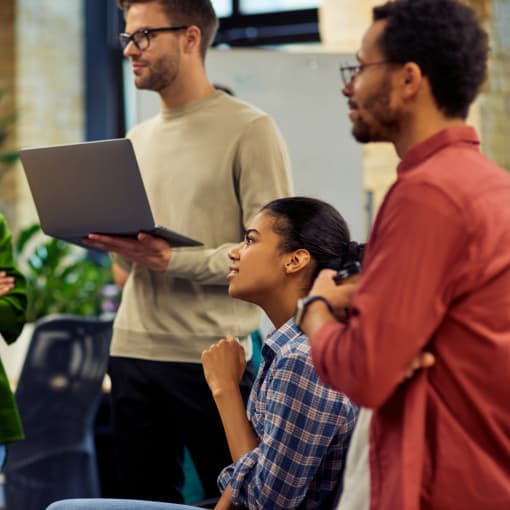 Office team members in standup meeting