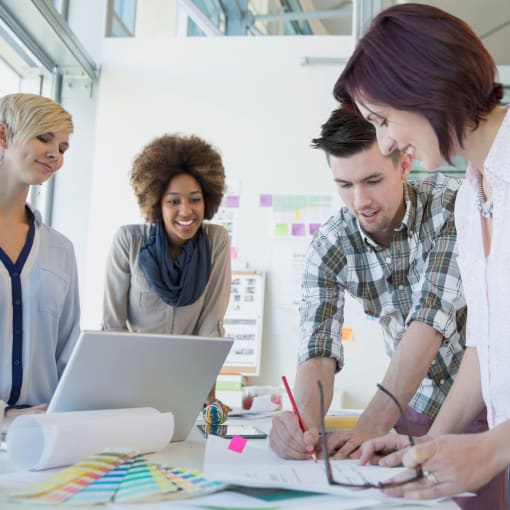 a group of 4 people collaborating on a project