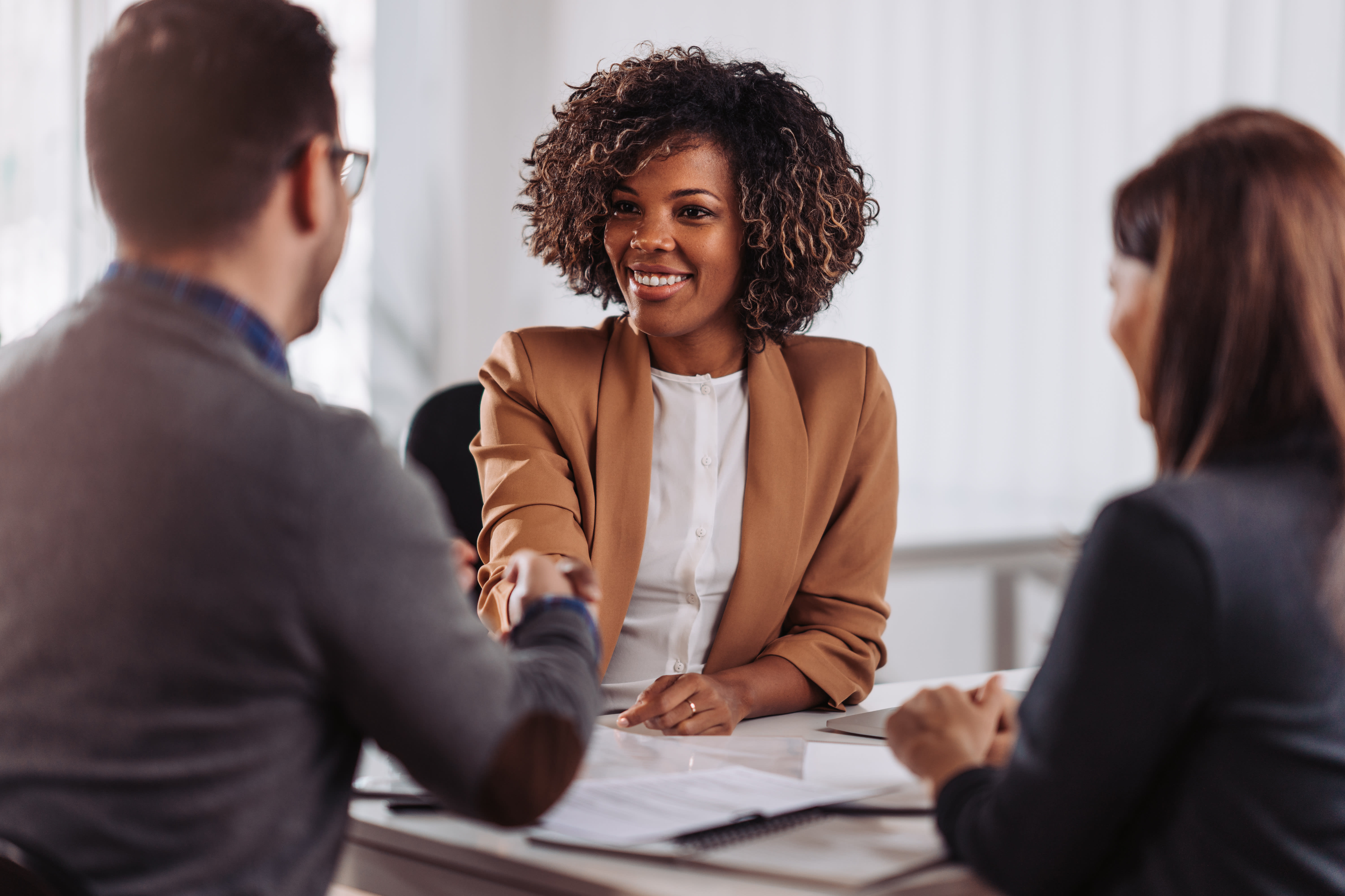 credit union employee meeting with customers