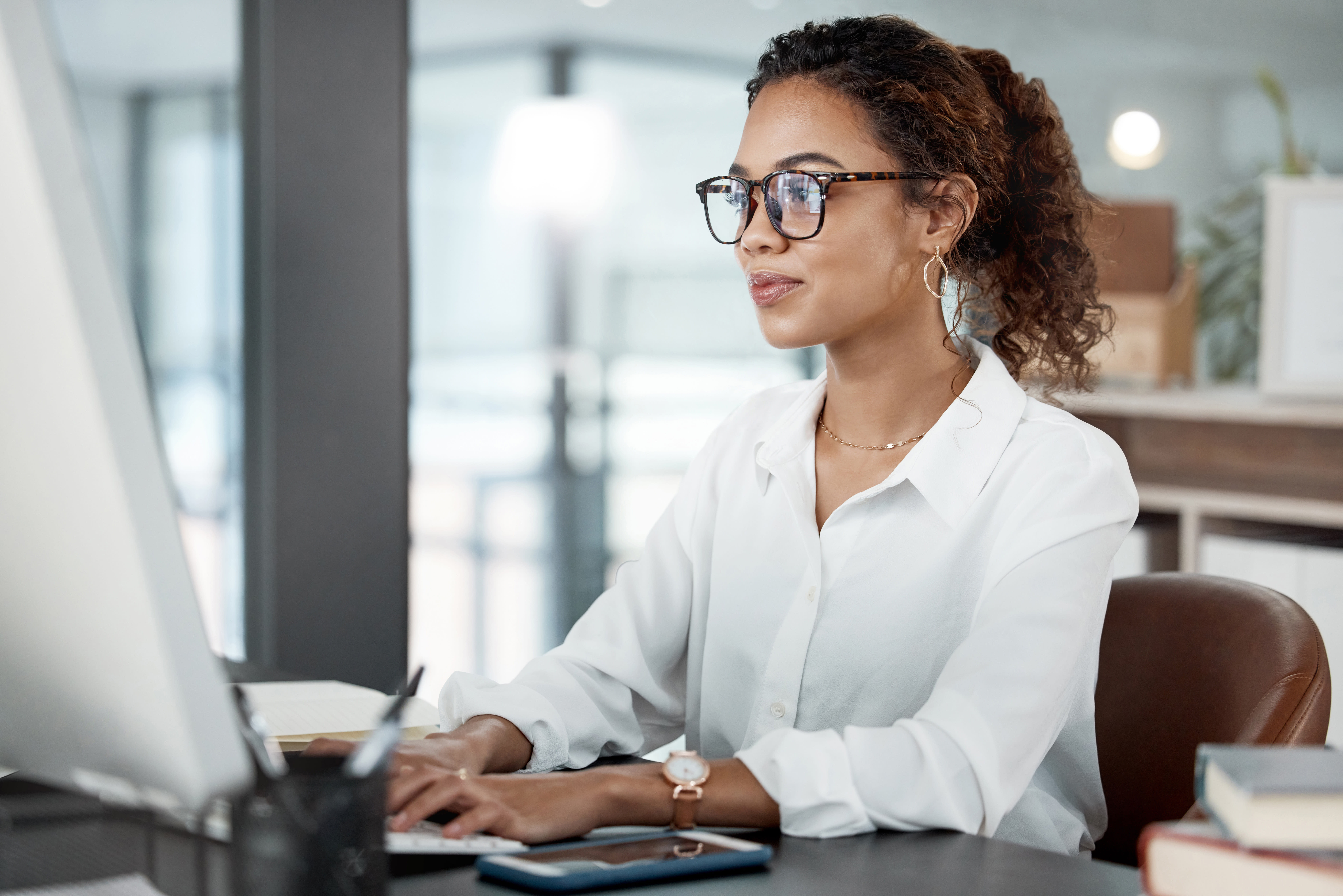 woman looking at a computer