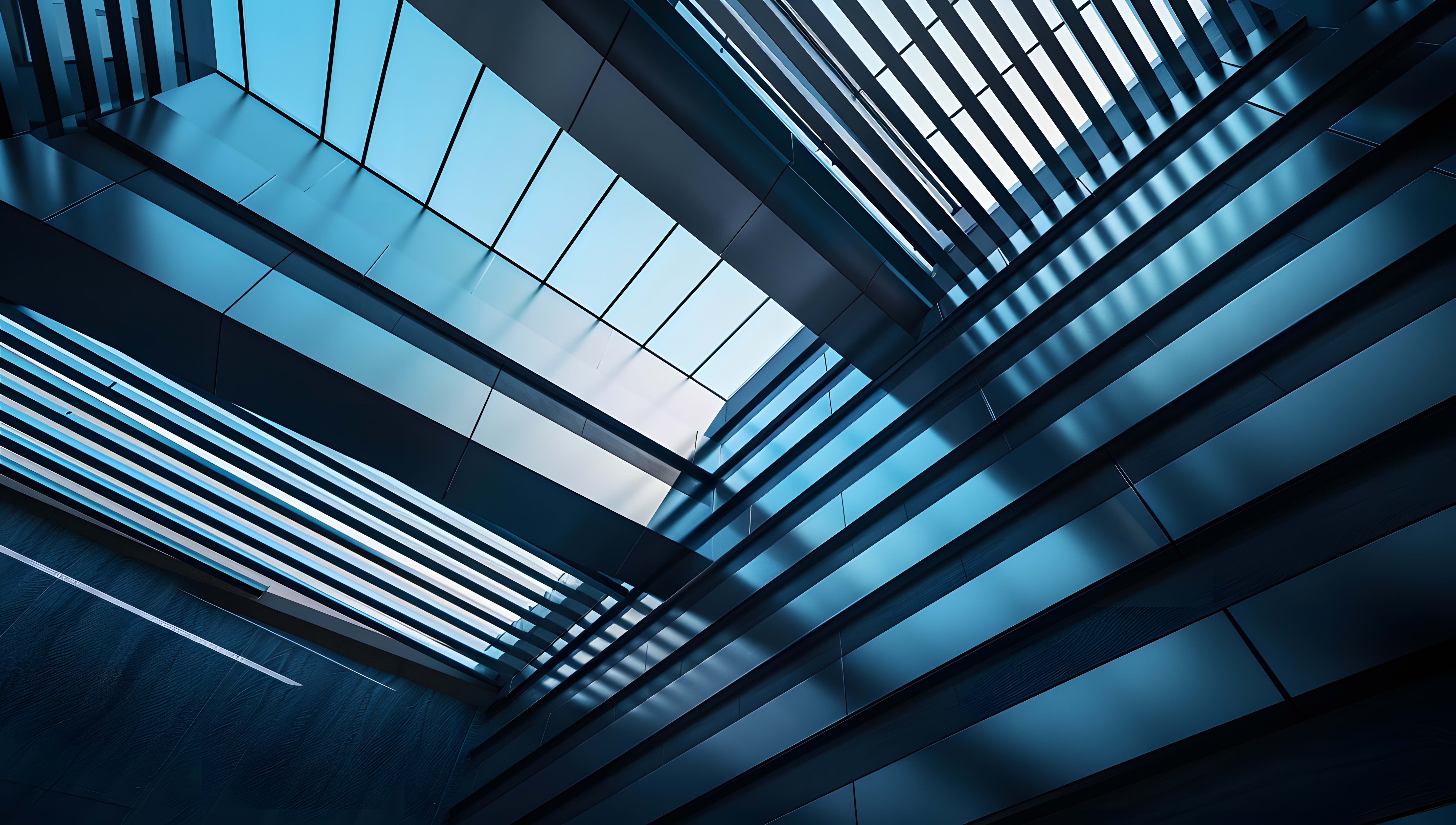 An upward perspective shot of a modern architectural interior, with geometric metal structures across the glass.