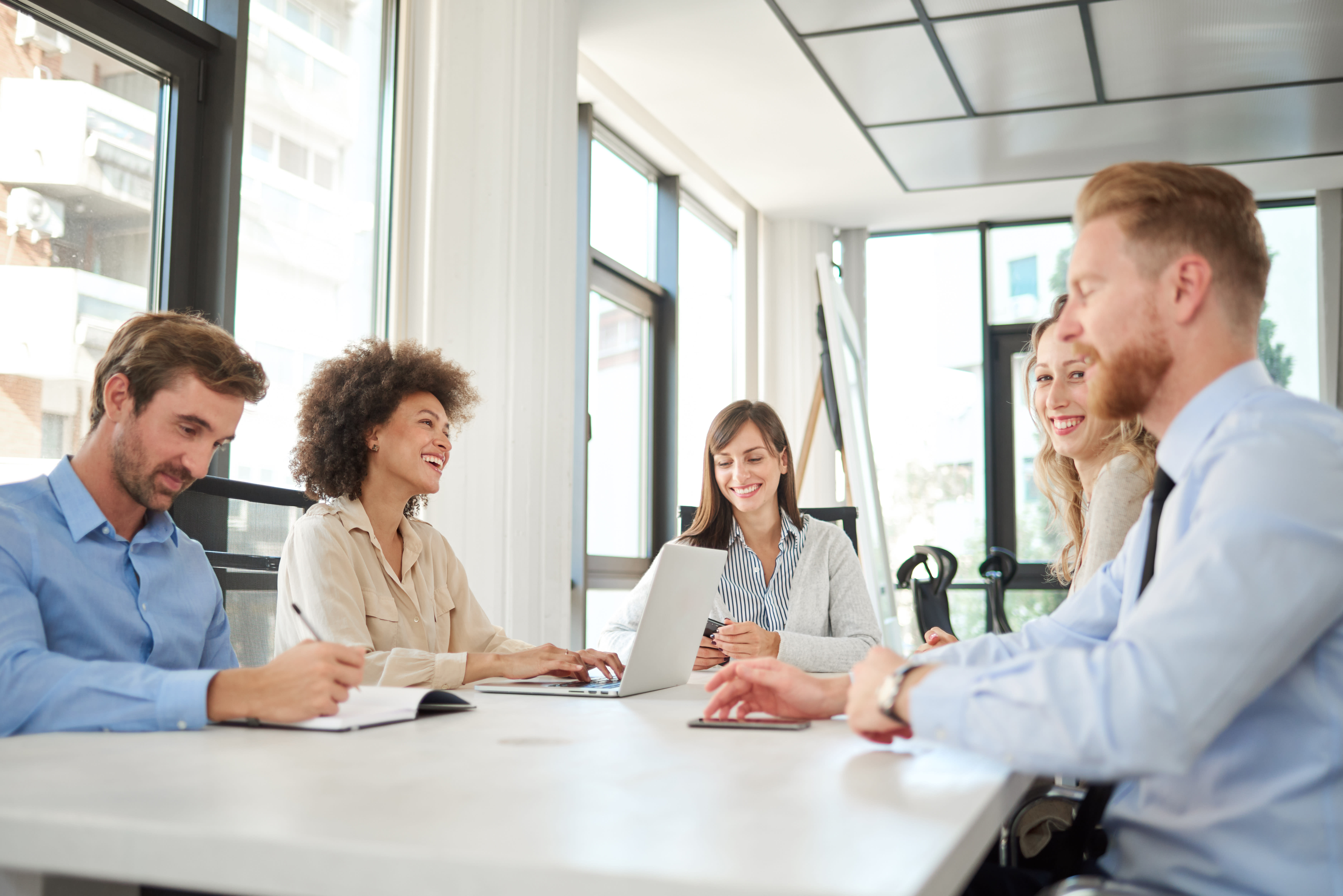 A group of professionals discussing on a table.