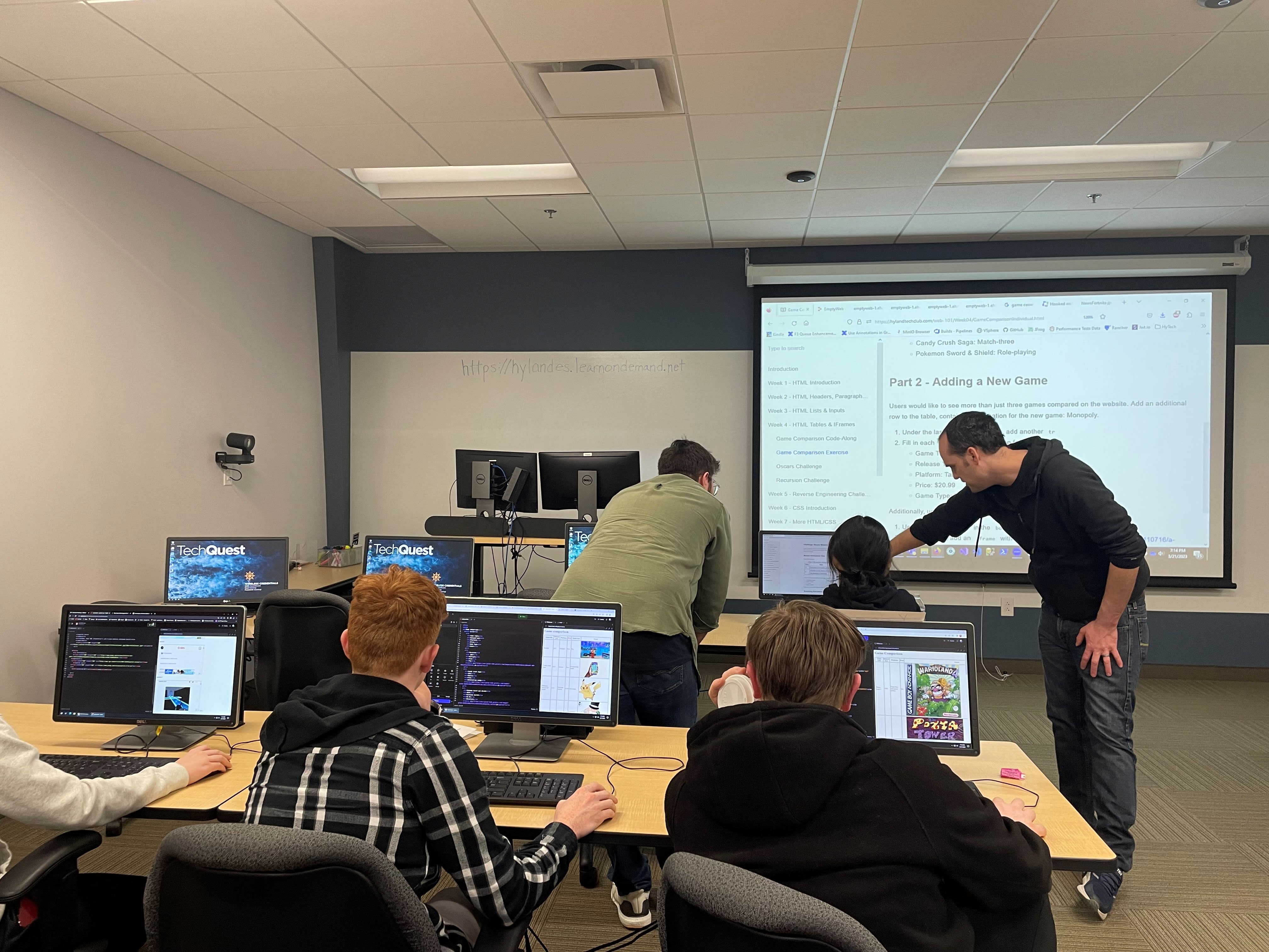 Instructor and students in a Hy-Tech Camps classroom