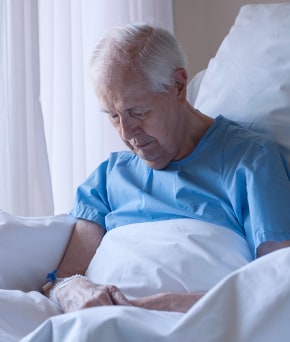 Elderly man in bed