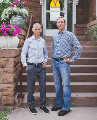 Stuart Mann and Josh Maximon in front of office