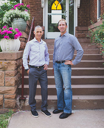 Stuart Mann and Josh Maximon in front of office