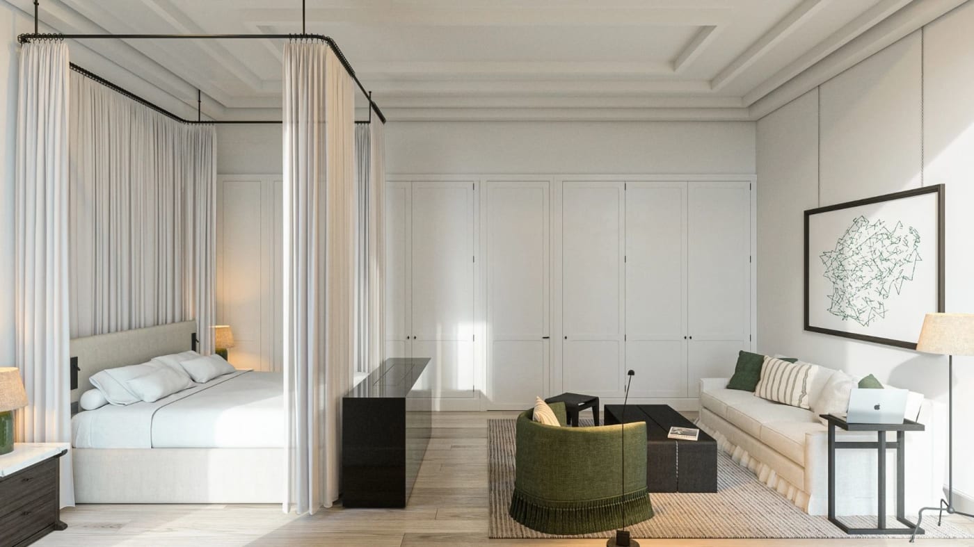 A Courtyard room at JNcQUOI House in Lisbon, with a four-poster bed in white and green tones