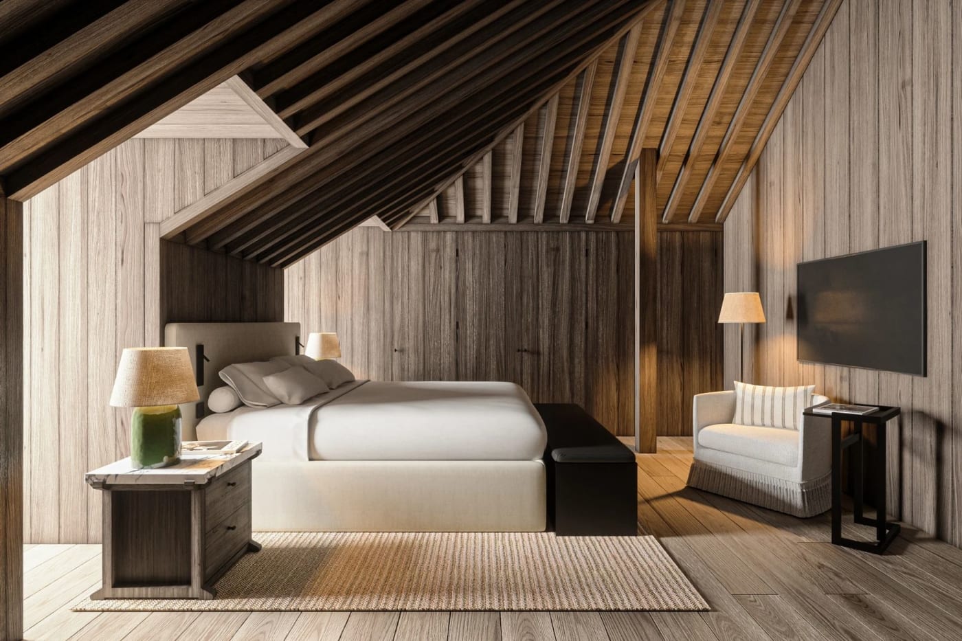 The Mansard Suite at JNcQUOI House in Lisbon, beneath wooden roof beams