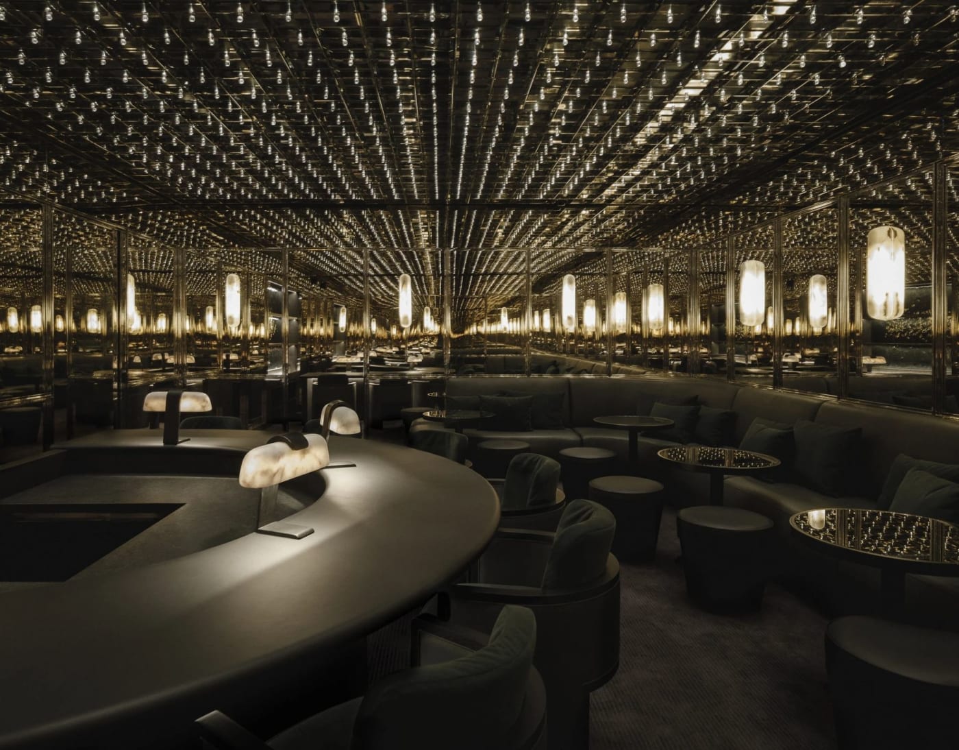 The Mirror Room bar beneath JNcQUOI House in Lisbon, with its ceiling of lights