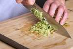 chef dicing cucumber for raita | Classpop Shot