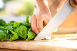 cutting garlic and basil Shot