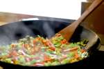 stir frying vegetables in a wok | Classpop Shot