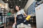 a woman making pottery in a pottery class Shot