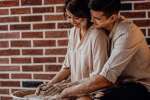 couple doing pottery together Shot