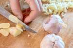 Ottawa - chef slicing garlic for gnocchi sauce Shot