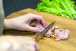 Cutting debones chicken Shot