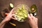 Making fresh guacamole Shot