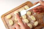 Shaping gnocchi by hand and fork Shot