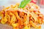 Handmade tagliatelle pasta with basil and tomato sauce Shot